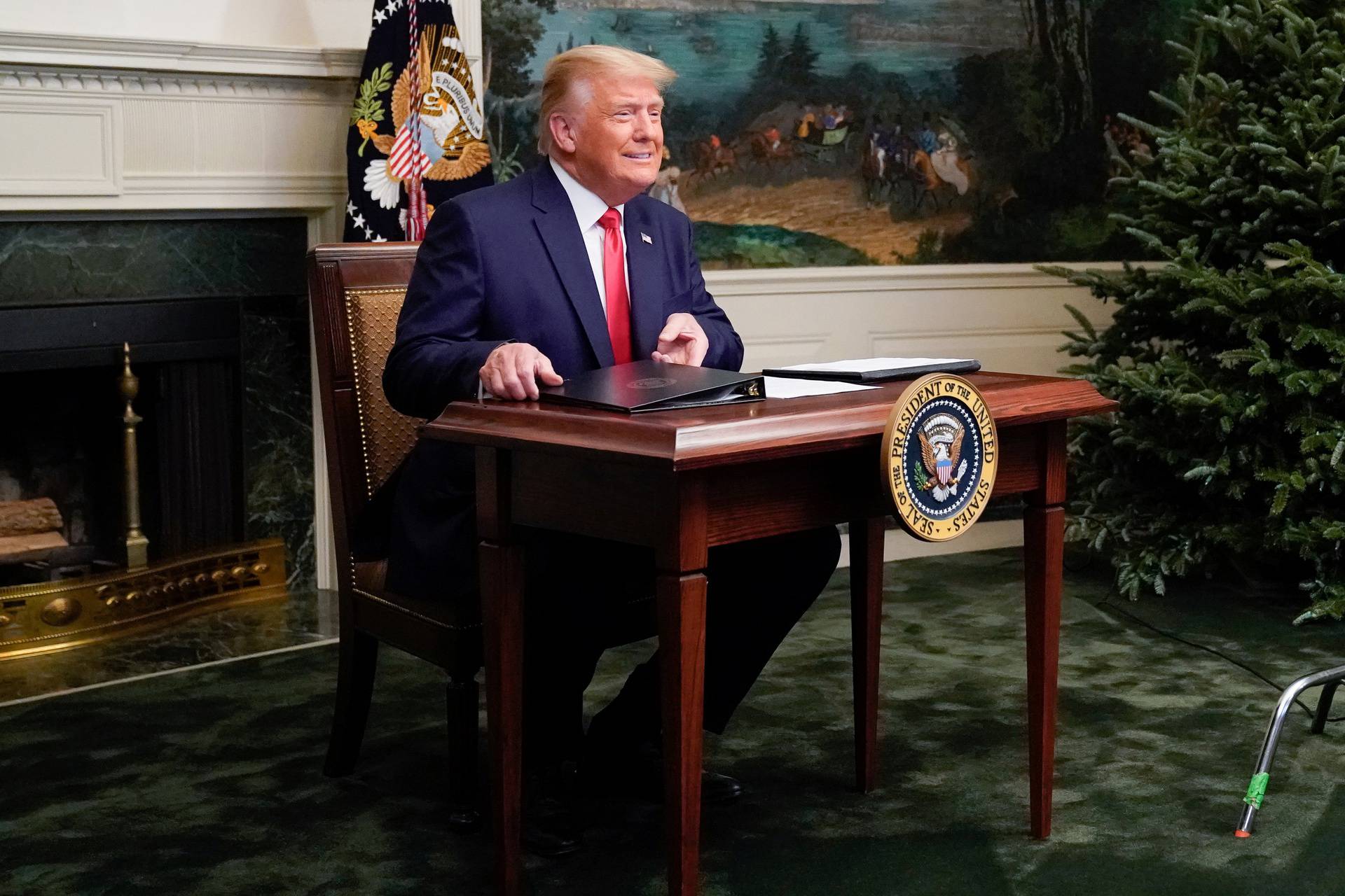 U.S. President Donald Trump arrives to a Thanksgiving video teleconference with members of the military forces at the White House in Washington