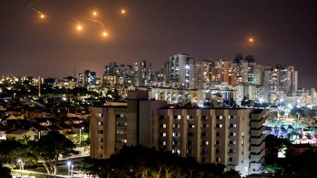 Flares illuminate the sky over northern Gaza, as seen from Ashkelon, southern Israel