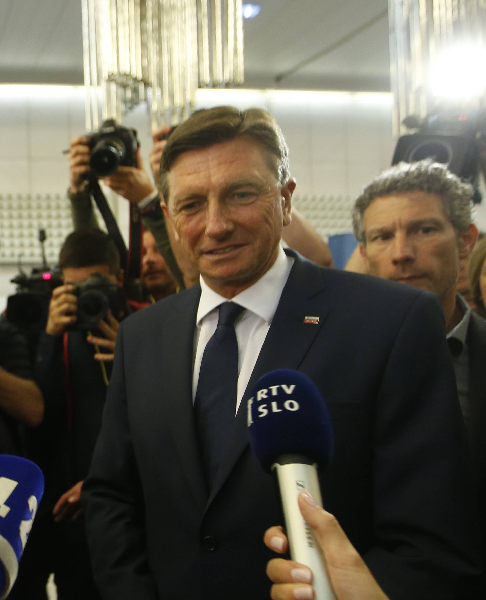 Presidential candidates Borut Pahor and Marjan Sarec answer questions from the media after the first round of the presidential election in Ljubljana