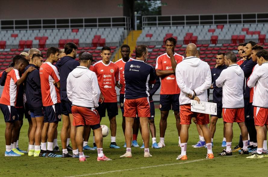 Costa Rica's national team coach Gustavo Matosas informs his players on his resignation before a training session at the National Stadium in San Jose