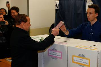 Forza Italia party leader Silvio Berlusconi casts his vote at a polling station in Milan