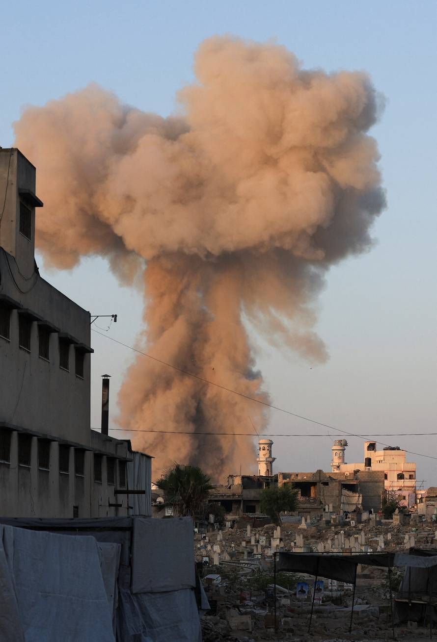 Smoke rises following an explosion during an Israeli operation, in Gaza City