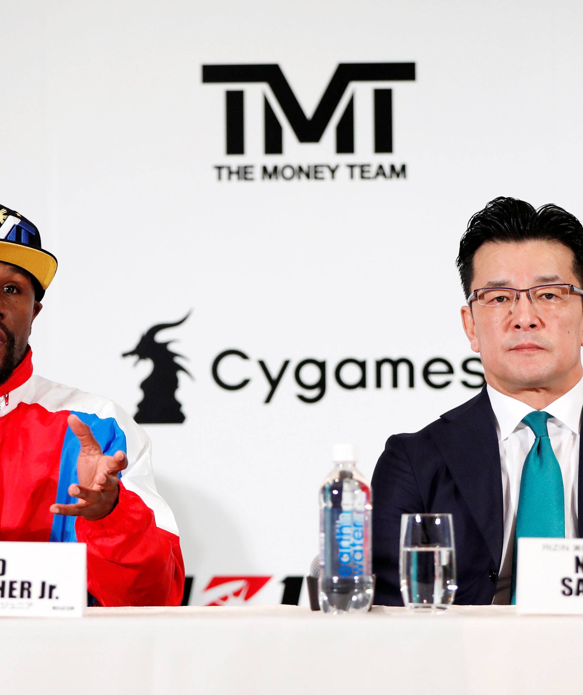 Boxer Floyd Mayweather Jr. of the U.S. and Rizin Chairman Nobuyuki Sakakibara attend a news conference in Tokyo