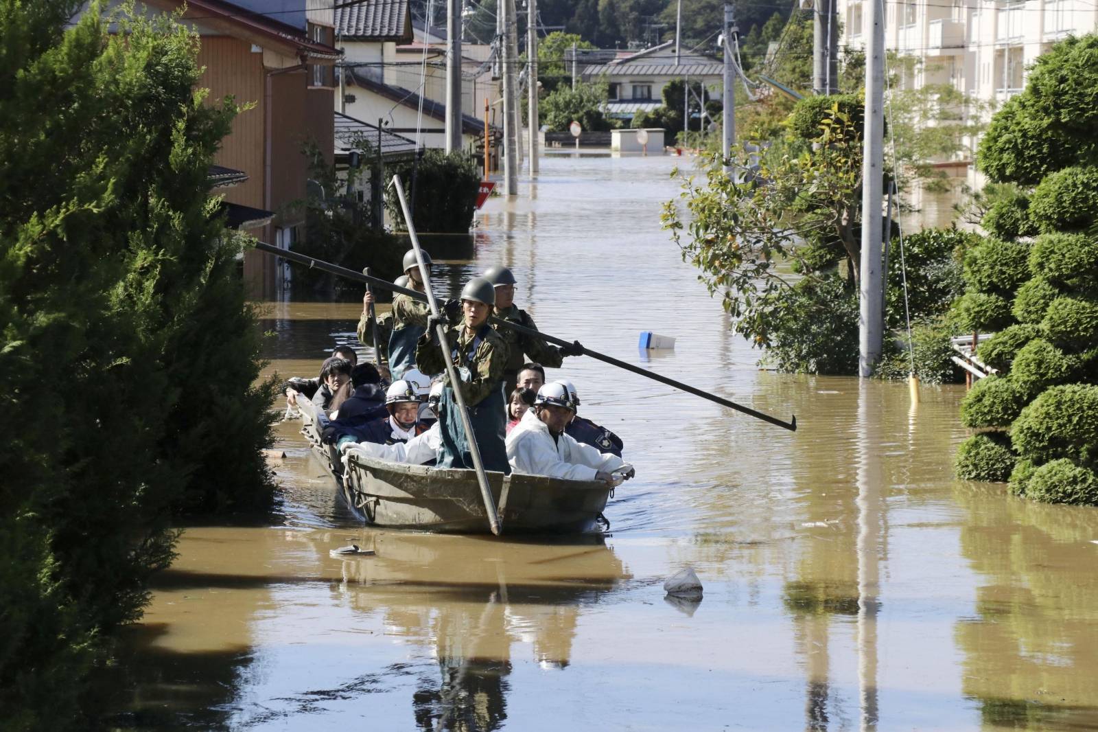 Local residents are rescued by Japapnese Defence-Force soldiers from a flooded area caused by Typhoon Hagibis in Kakuda