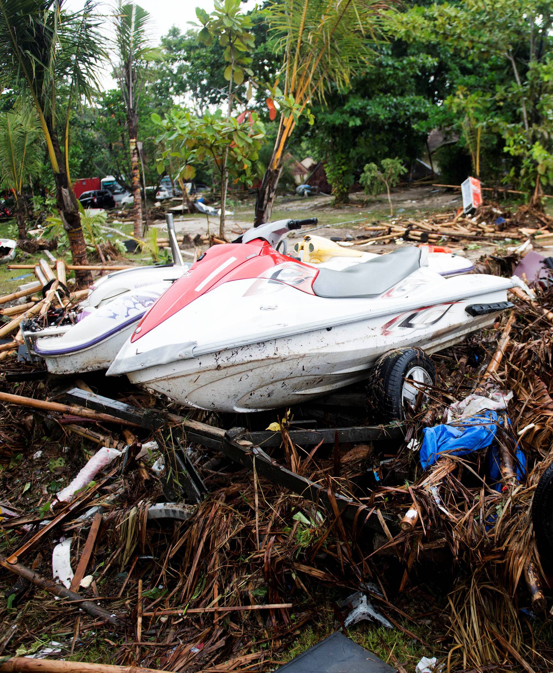 Debris are seen after a tsunami hit Tanjung Lesung beach in Banten