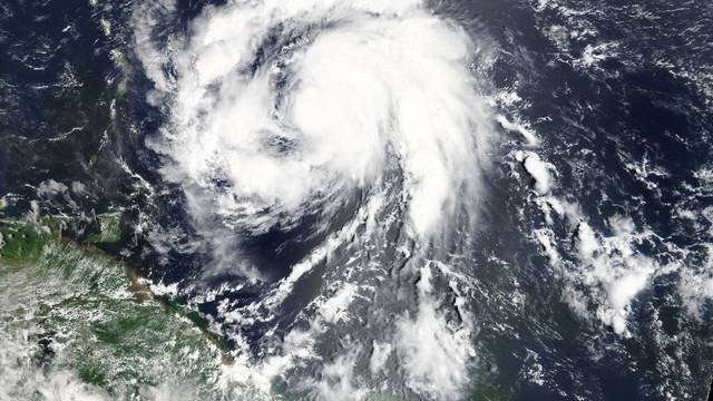 Hurricane Maria is shown in the Atlantic Ocean about 85 miles east of Martinique in this NASA handout satellite photo