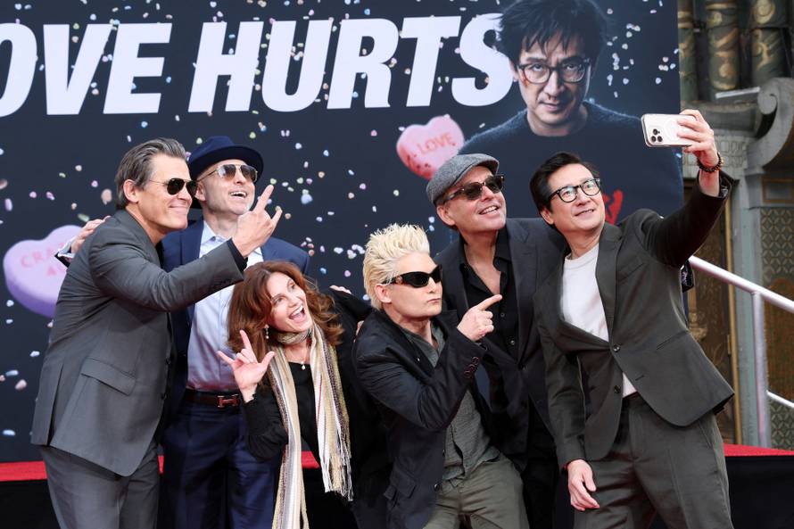 Actor Ke Huy Quan places his handprints in cement during a ceremony at TCL Chinese Theatre, in Hollywood