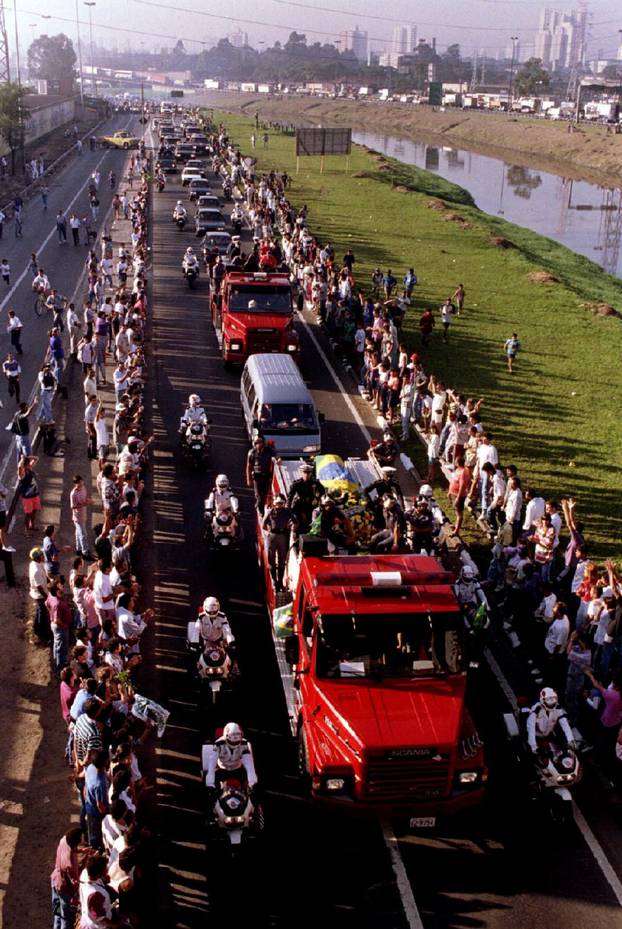 FILE PHOTO: A motorcade accompanying the coffin of Senna makes its way from Sao Paulo airport to the city center in Brazil