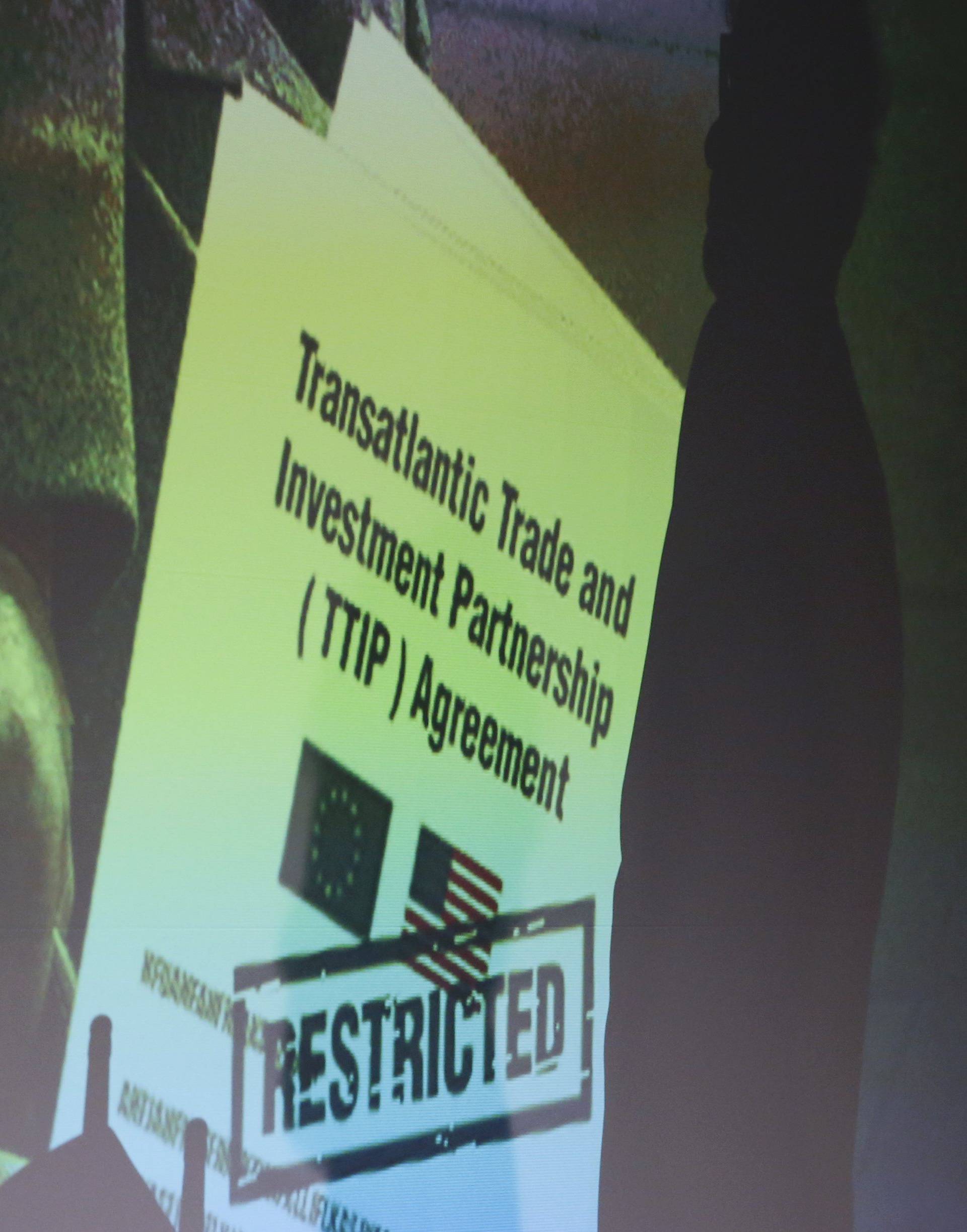 A copy of the restricted TTIP negotiations is projected to a screen during a news conference of Greenpeace in Berlin 