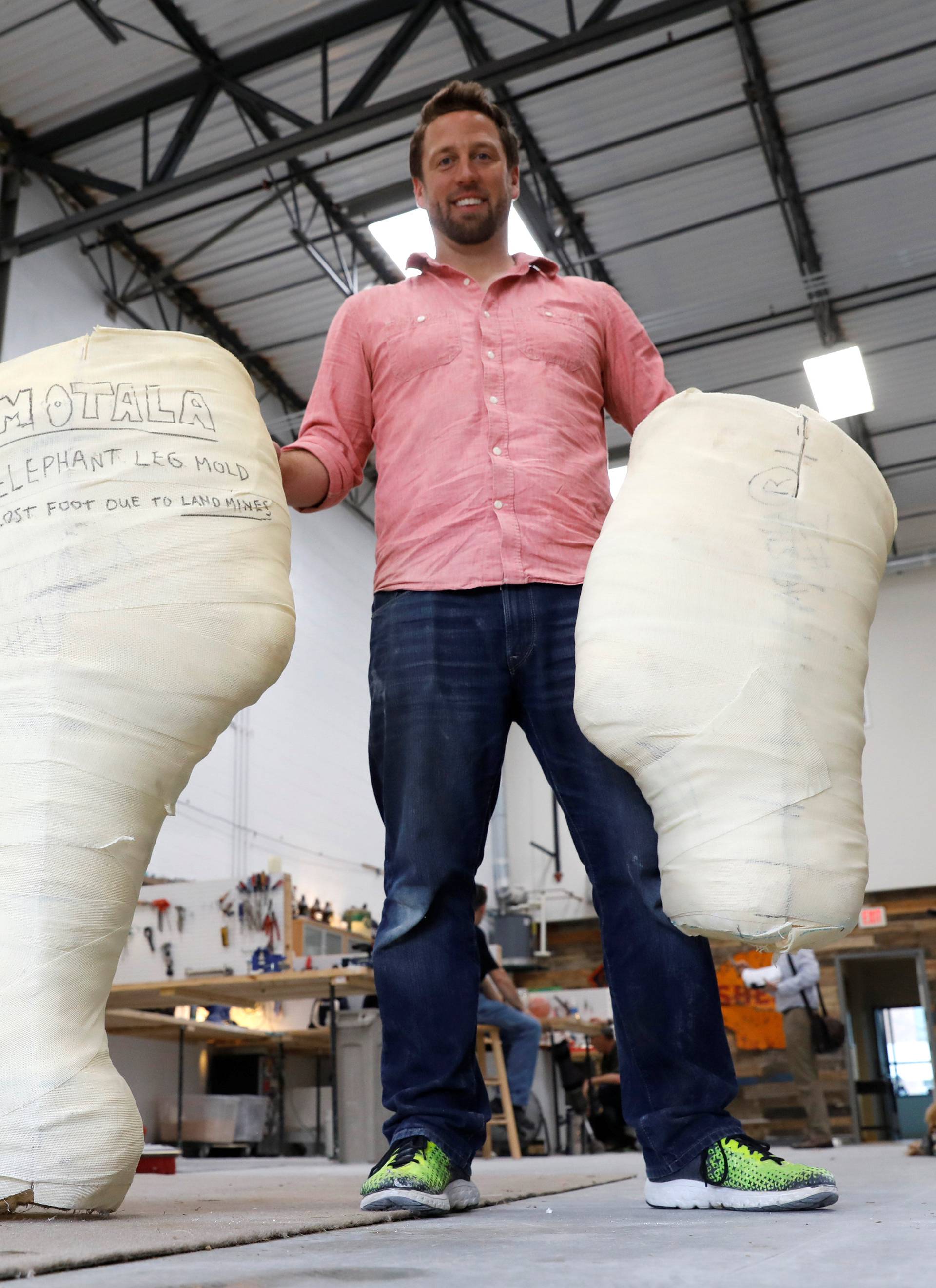 Derrick Campana displays an elephant prosthetic mold in Sterling, Virginia