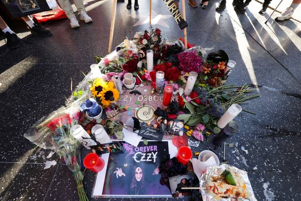 Flowers and pictures are placed on the star of late Ozzy Osbourne at the Hollywood Walk of Fame in Los Angeles