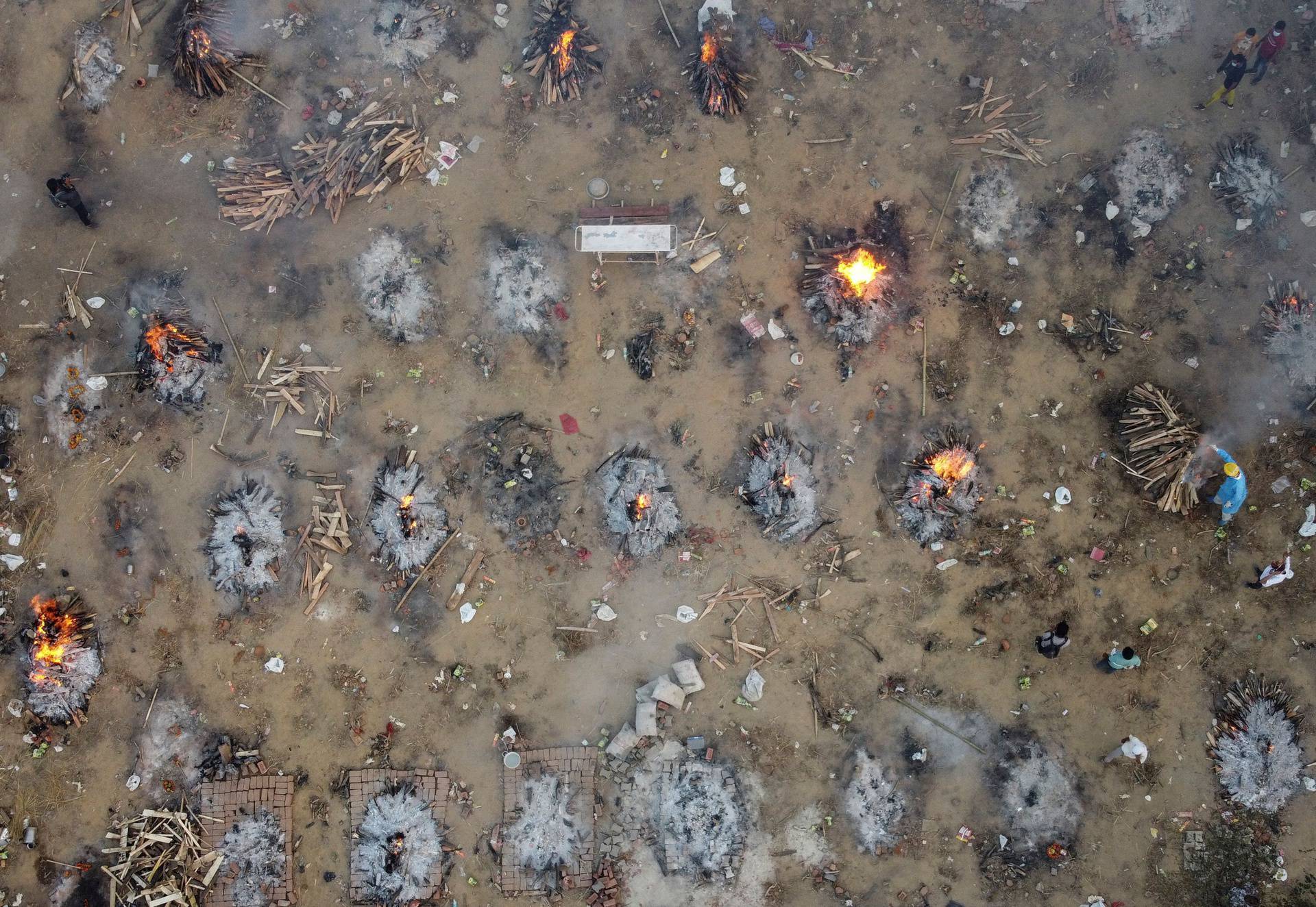 A mass cremation of victims who died due to the coronavirus disease (COVID-19), is seen at a crematorium ground in New Delhi