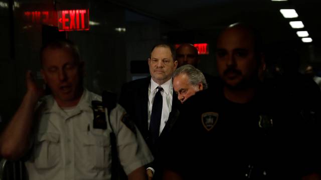 Film producer Harvey Weinstein arrives for his arraignment at Manhattan Criminal Court in New York