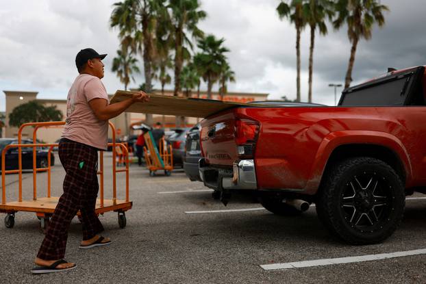 People prepare for the arrival of Hurricane Milton in Orlando