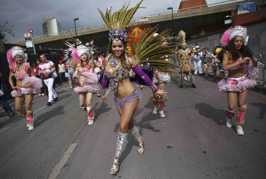 Performers participate in the parade at the Notting Hill Carnival in London