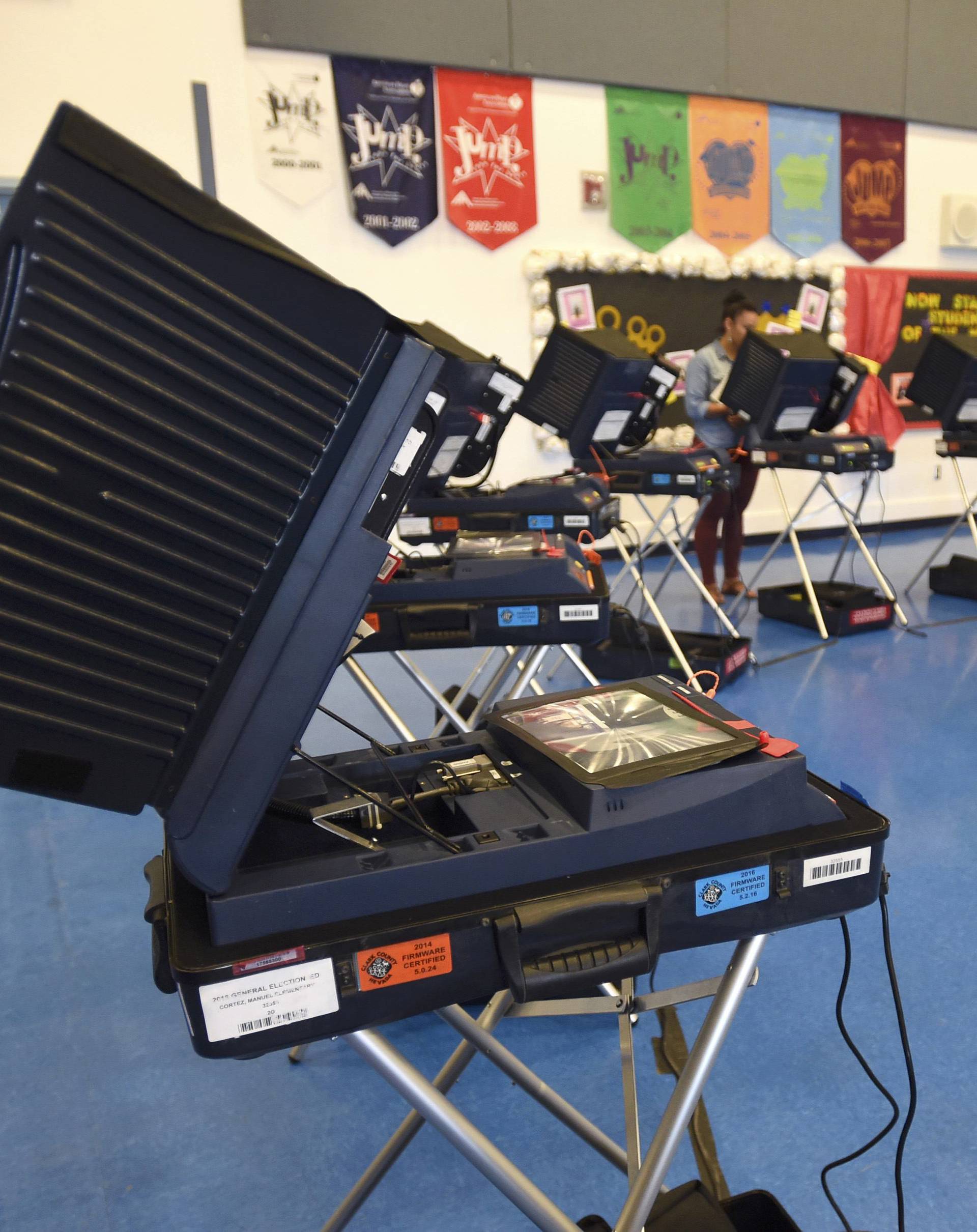 Voting machines are set up for people to cast their ballots during voting in the 2016 presidential election at Manuel J. Cortez Elementary School in Las Vegas, Nevada