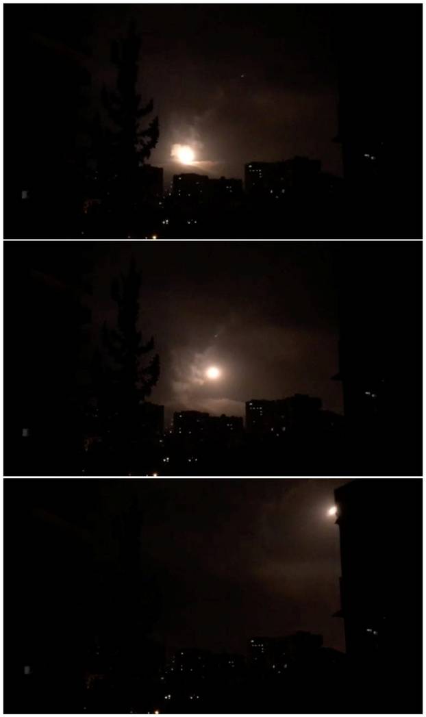Combination photo of still images show Syria air defences striking back after air strikes by U.S., British and French forces in Damascus