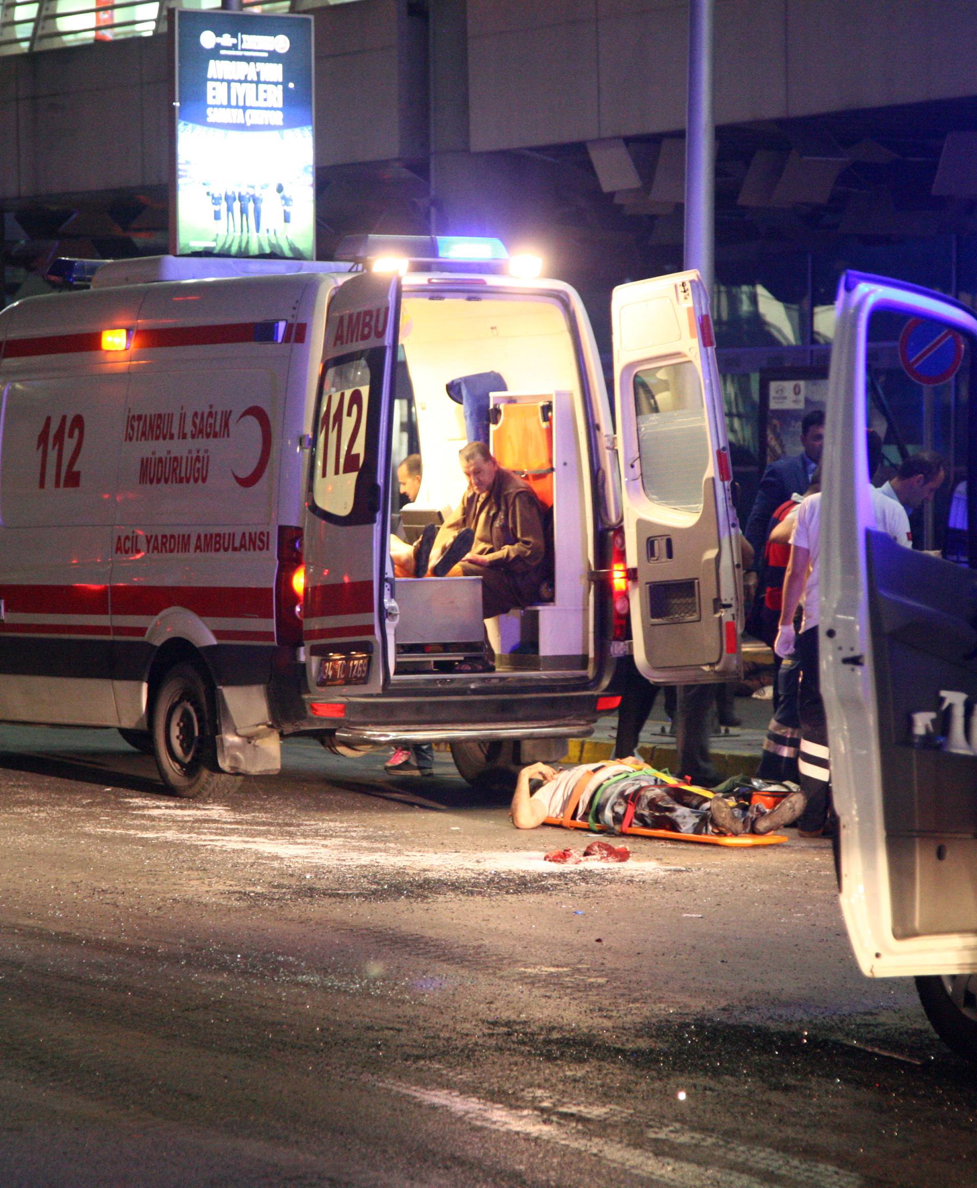Paramedics attend to casualties outside Turkey's largest airport, Istanbul Ataturk, Turkey, following an attack