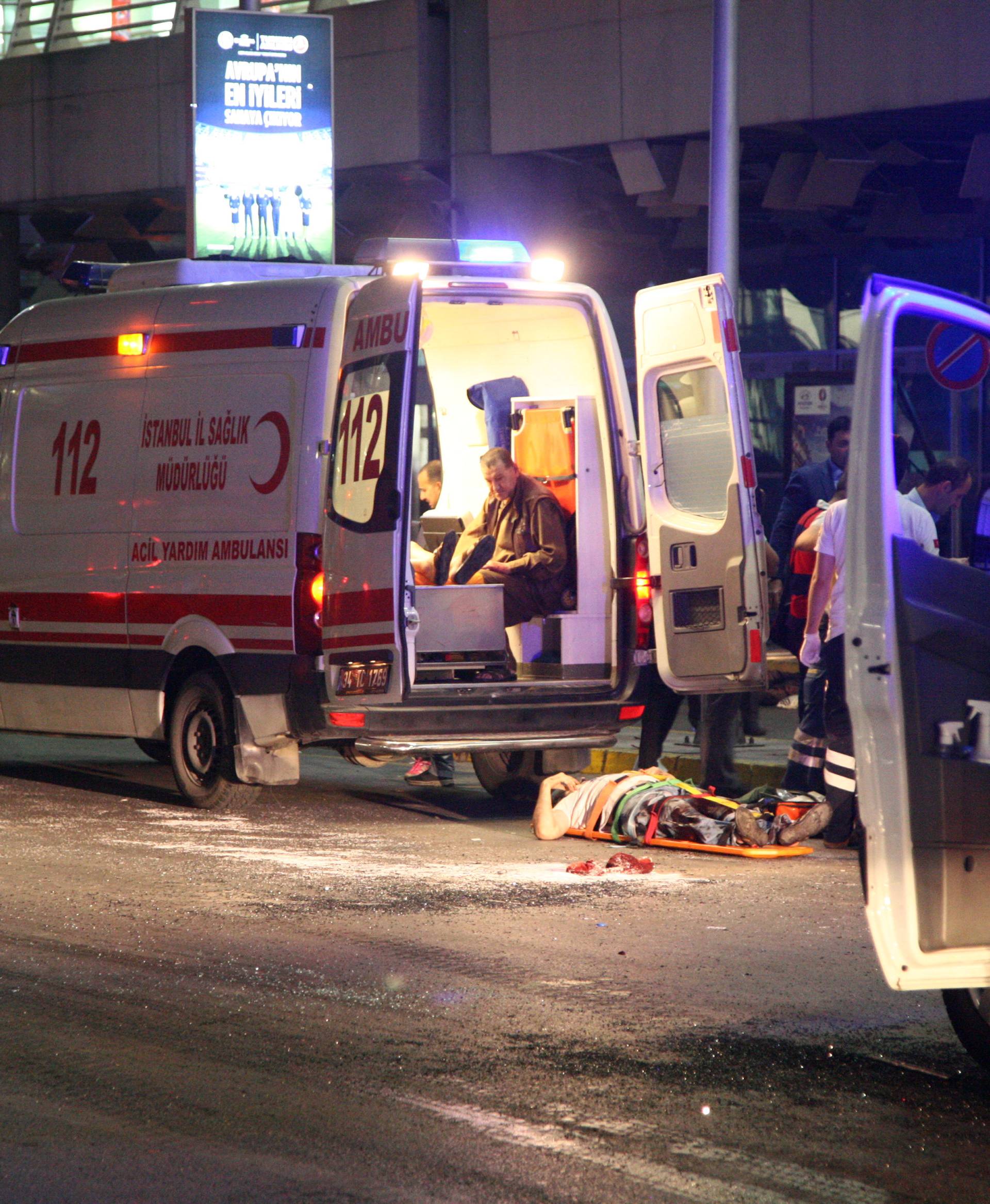 Paramedics attend to casualties outside Turkey's largest airport, Istanbul Ataturk, Turkey, following an attack