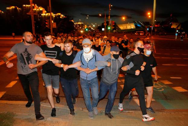 Clashes with opposition supporters after polls closed at the presidential election in Minsk