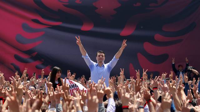 Democratic Party leader Basha waves to his supporters during a protest against the government in front of Prime Minister Rama's office, in Tirana