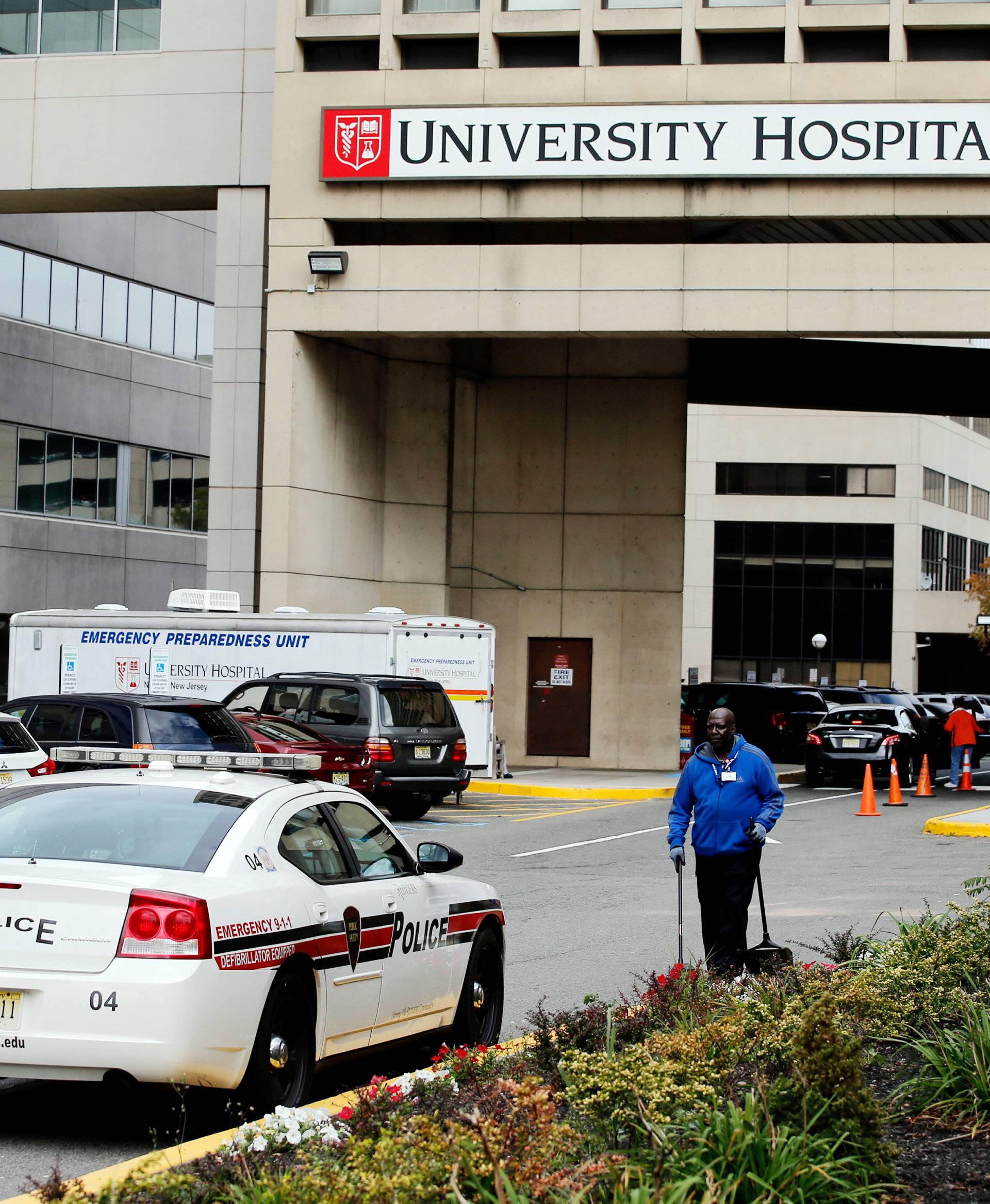 A police car is seen near the entrance of University Hospital where Ahmad Khan Rahimi has been recovering from gunshot wounds he suffered in a shootout with police before his arrest, in New Jersey