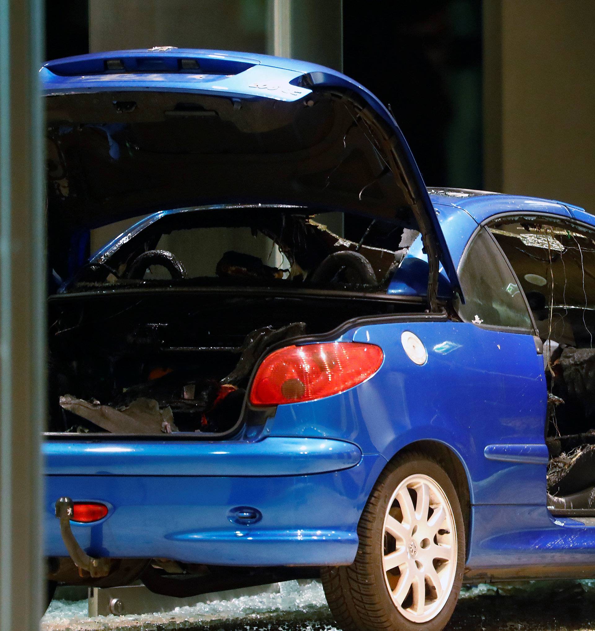 A damaged car is pictured inside the party headquarters of the Social Democratic Party of Germany (SPD) after it crashed into the building in Berlin