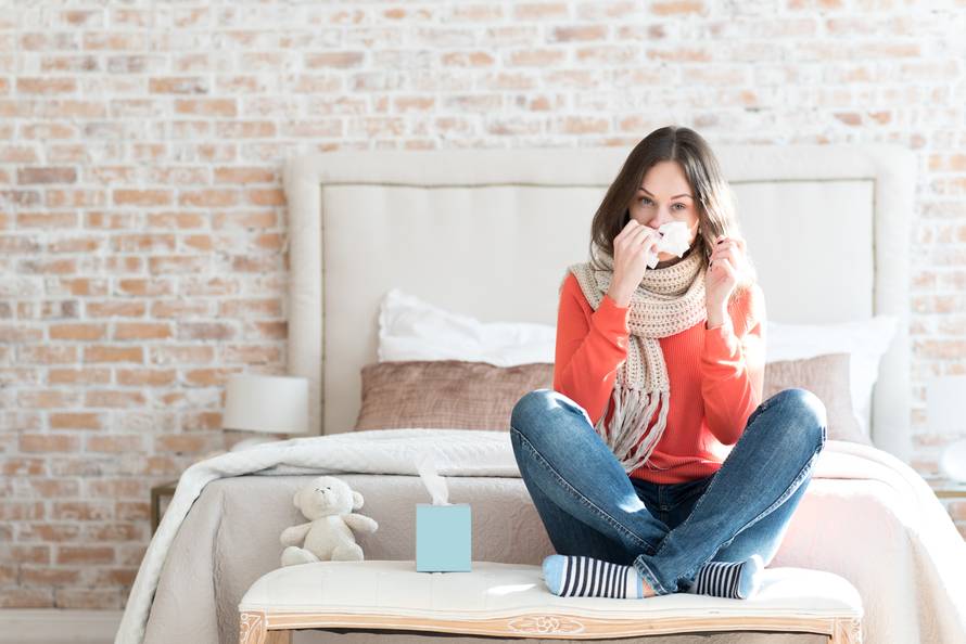 Pleasant gloomy woman suffering from cold