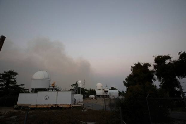 Smoke rises near Mount Wilson Observatory during the Bobcat Fire in Los Angeles