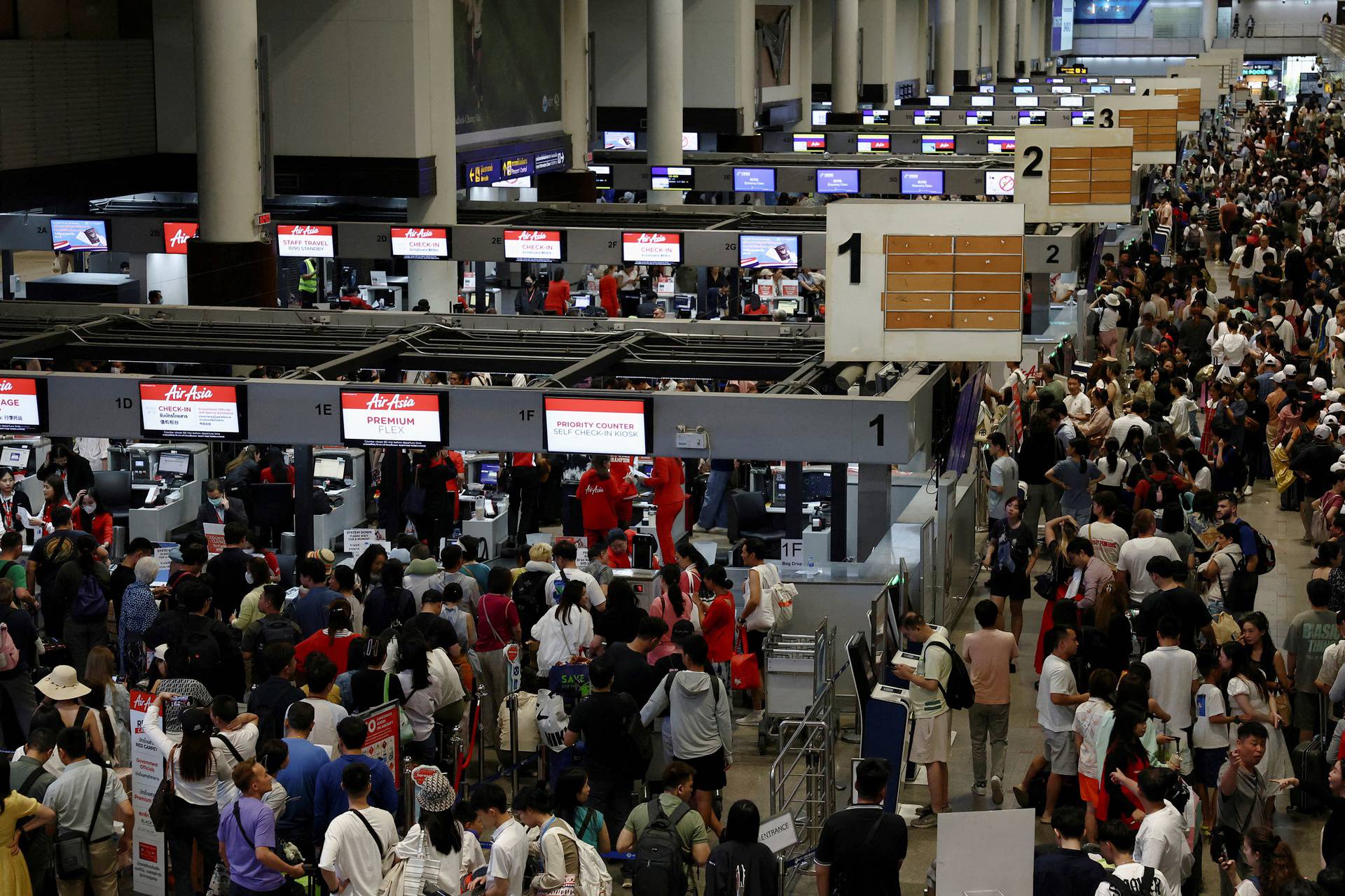 Don Mueang International Airport Terminal 1 amid system outages disrupting the airline's operations in Bangkok