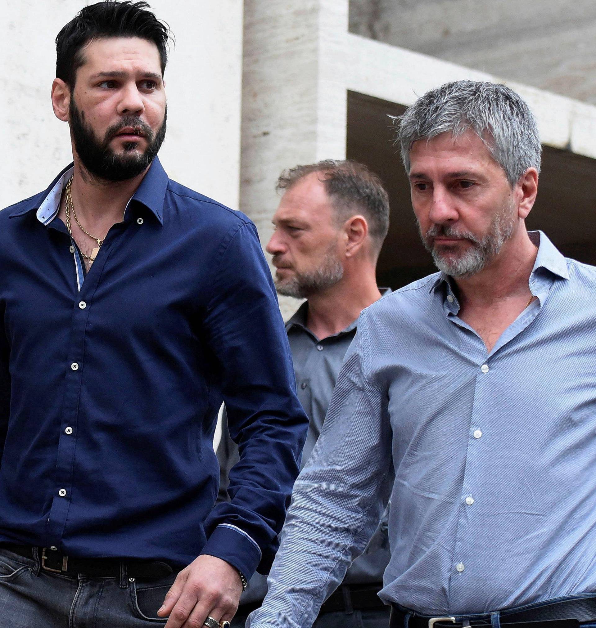 Matias Messi, brother of Lionel Messi, and his father Jorge Messi leave a court after agreeing to pay bail after Matias was arrested for possession of a weapon in Rosario, Argentina