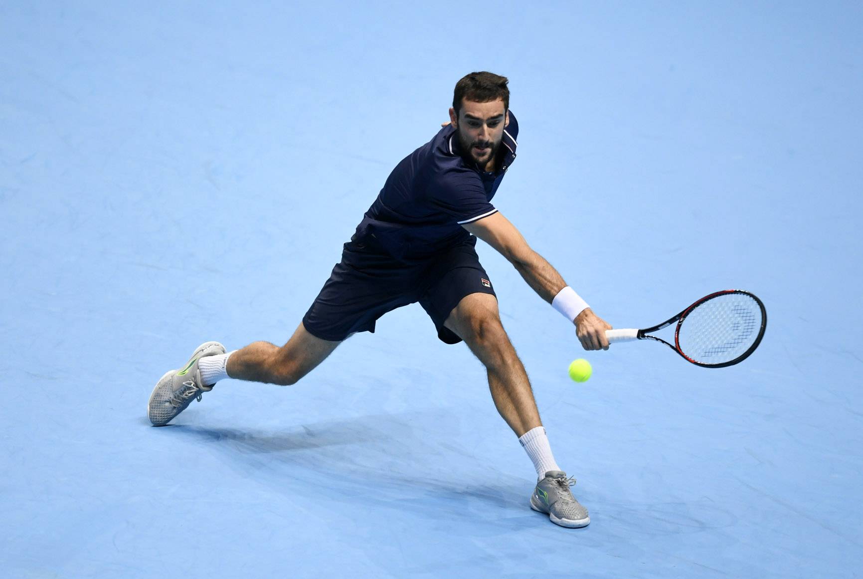 Croatia's Marin Cilic in action during his round robin match with Switzerland's Stanislas Wawrinka