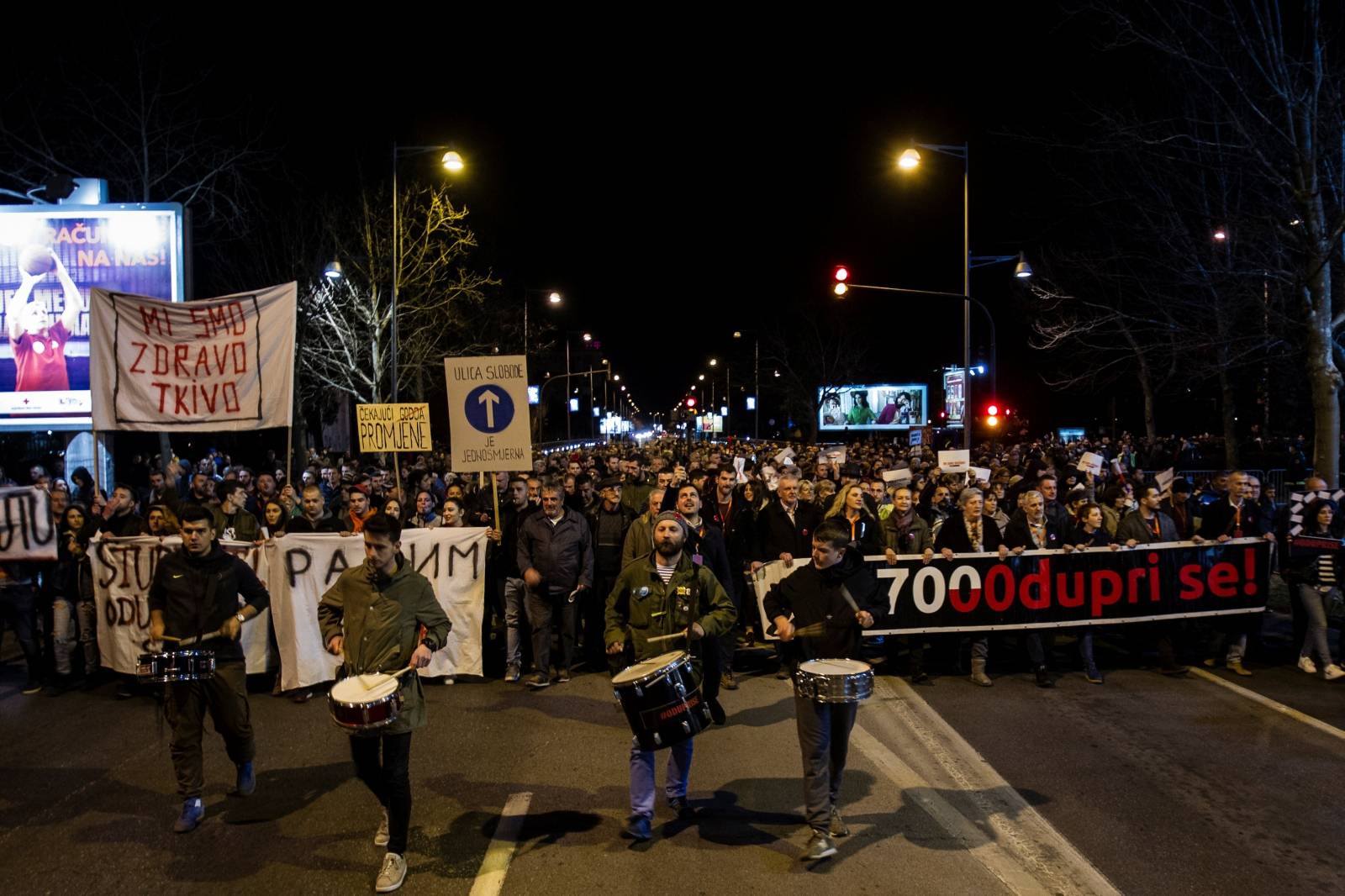 Demonstrators march during civic protest in Podgorica