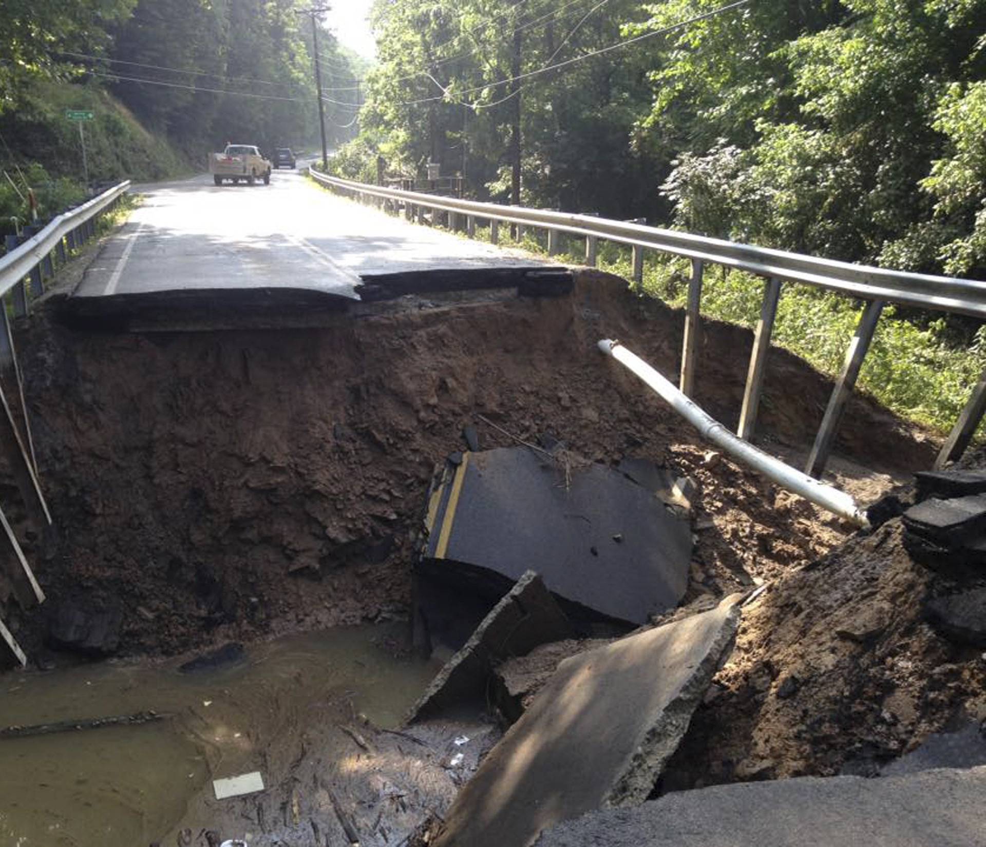 The West Virginia State Highway 4 along the Elk River shows extensive damage after flood water has dropped in the Clendenin