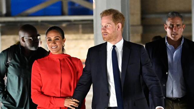 Megan and Harry catch a train