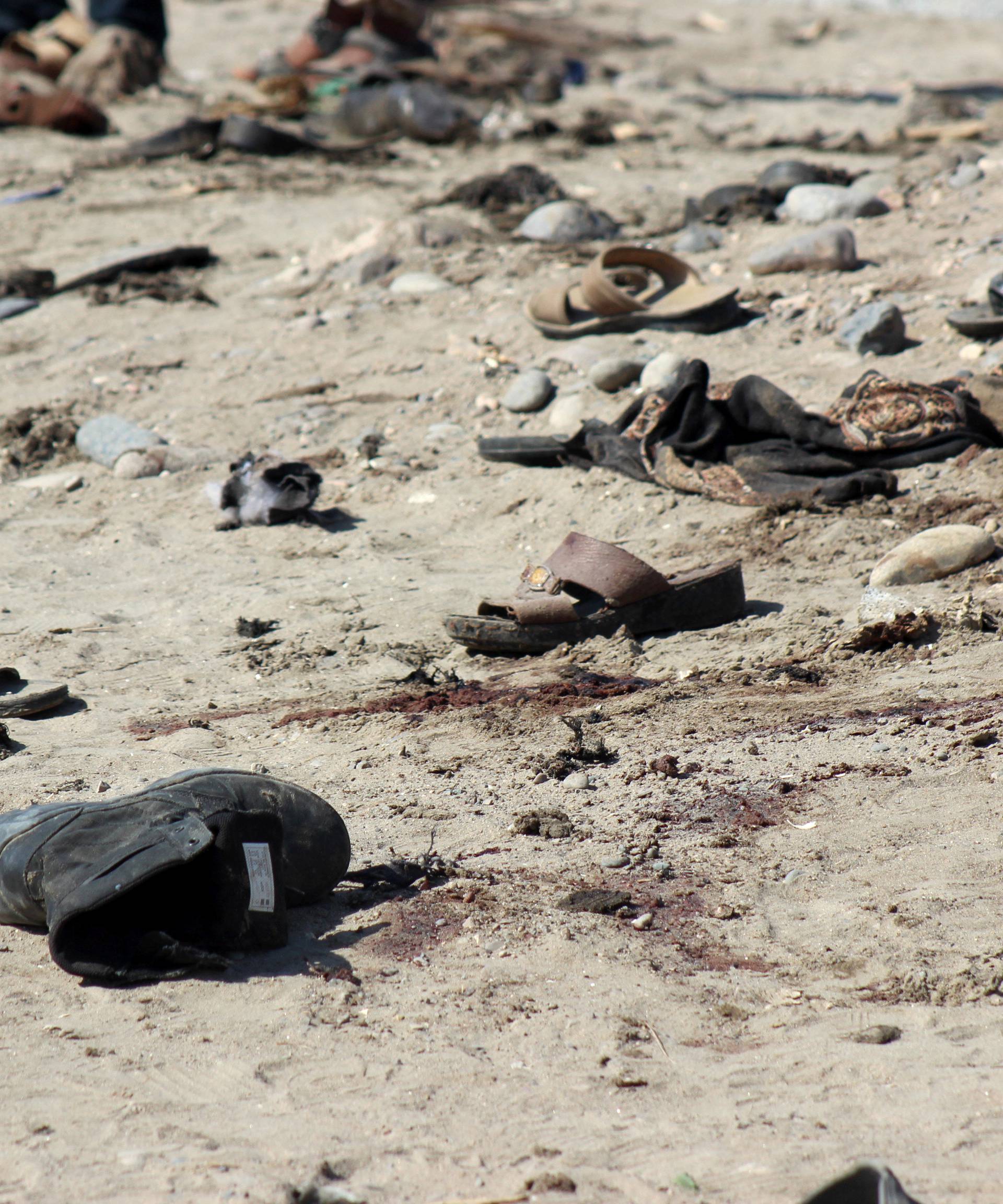 Shoes are seen at the site of a suicide bombing in the southern port city of Aden, Yemen