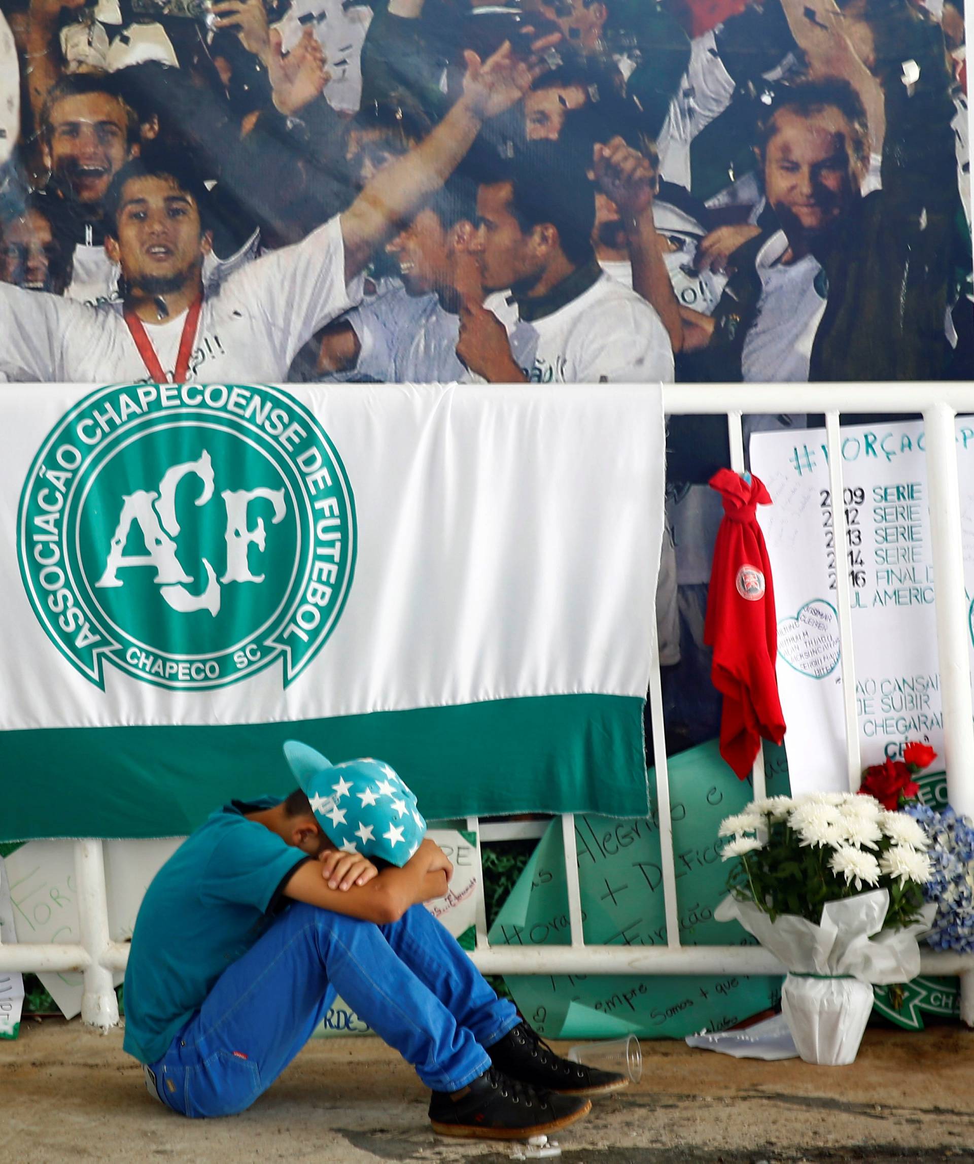 A young fan of Chapecoense soccer team reacts at the Arena Conda stadium in Chapeco