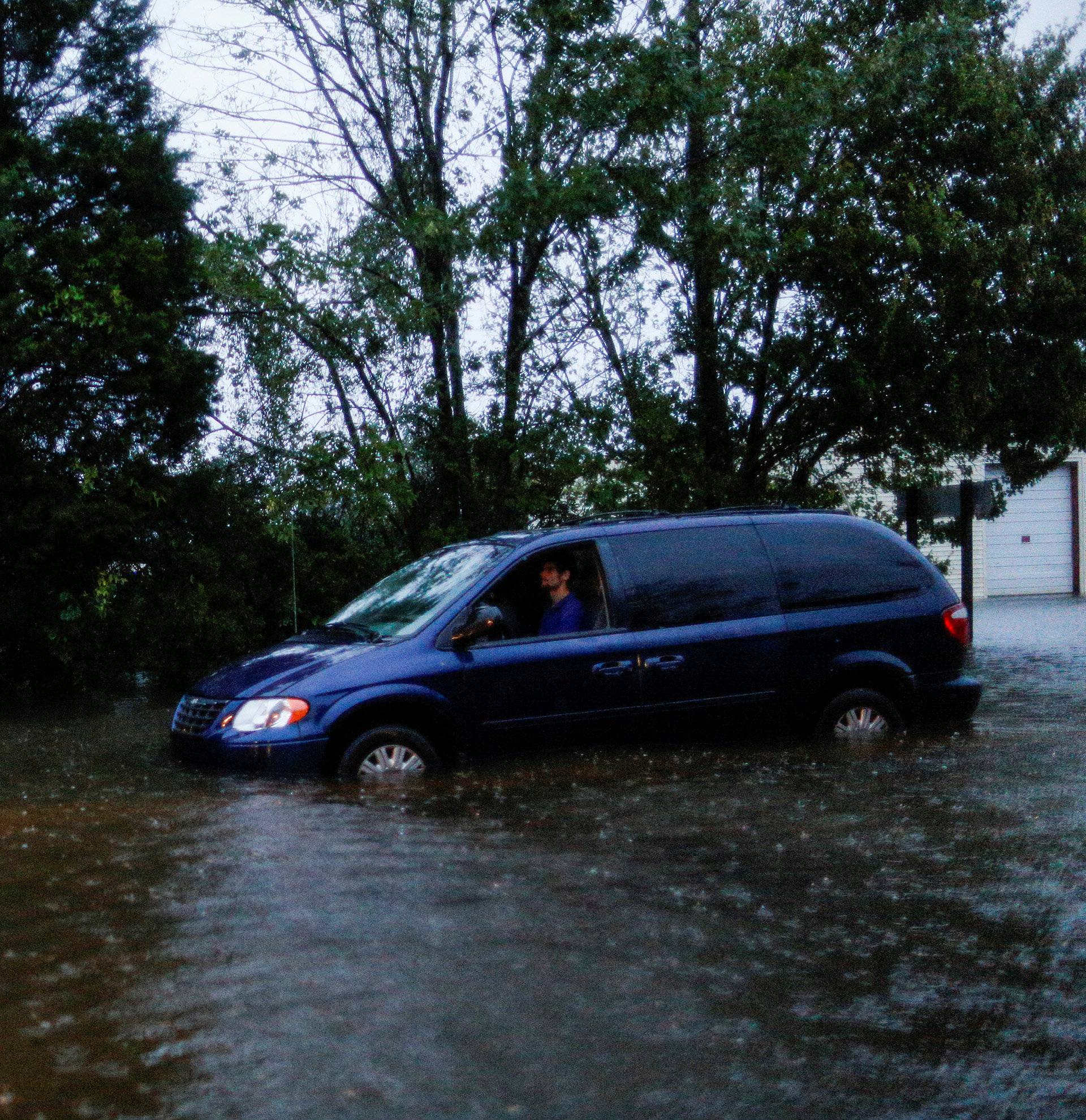 People wait to be rescued by members of the U.S. Army during the passing of Hurricane Florence in the town of New Bern