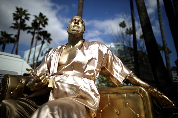 A statue of Harvey Weinstein on a casting couch made by artist Plastic Jesus is seen on Hollywood Boulevard near the Dolby Theatre during preparations for the Oscars in Hollywood, Los Angeles