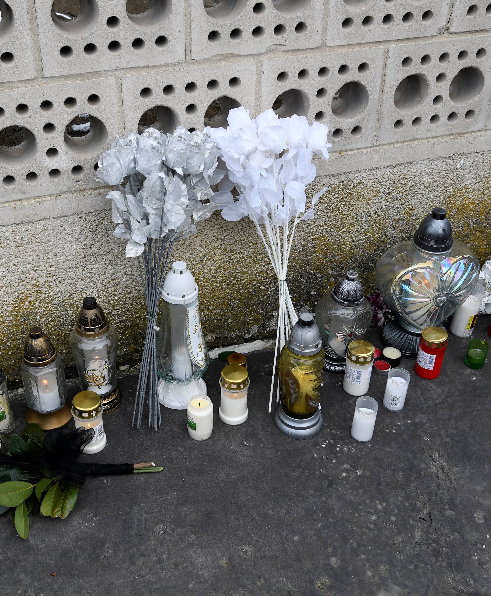 Candles and flowers are seen near to the house where Slovak investigative journalist Jan Kuciak and his girlfriend Martina Kusnirova lived and were murdered in the village of Velka Maca