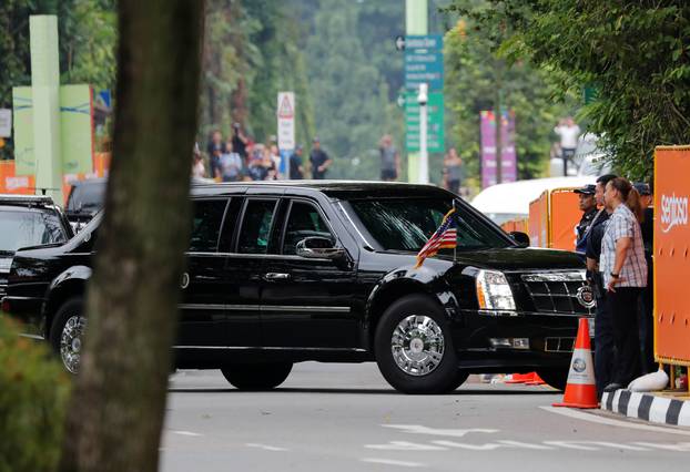 The motorcade of U.S. President Donald Trump arrives at the Capella hotel, the venue of the summit between North Korea and the U.s., on Sentosa island in Singapore