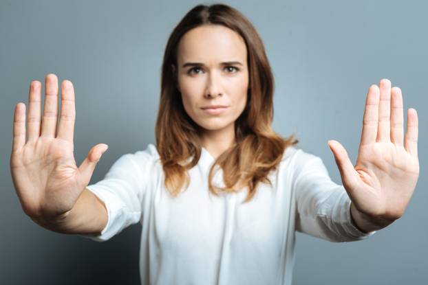 Serious nice woman showing her palms