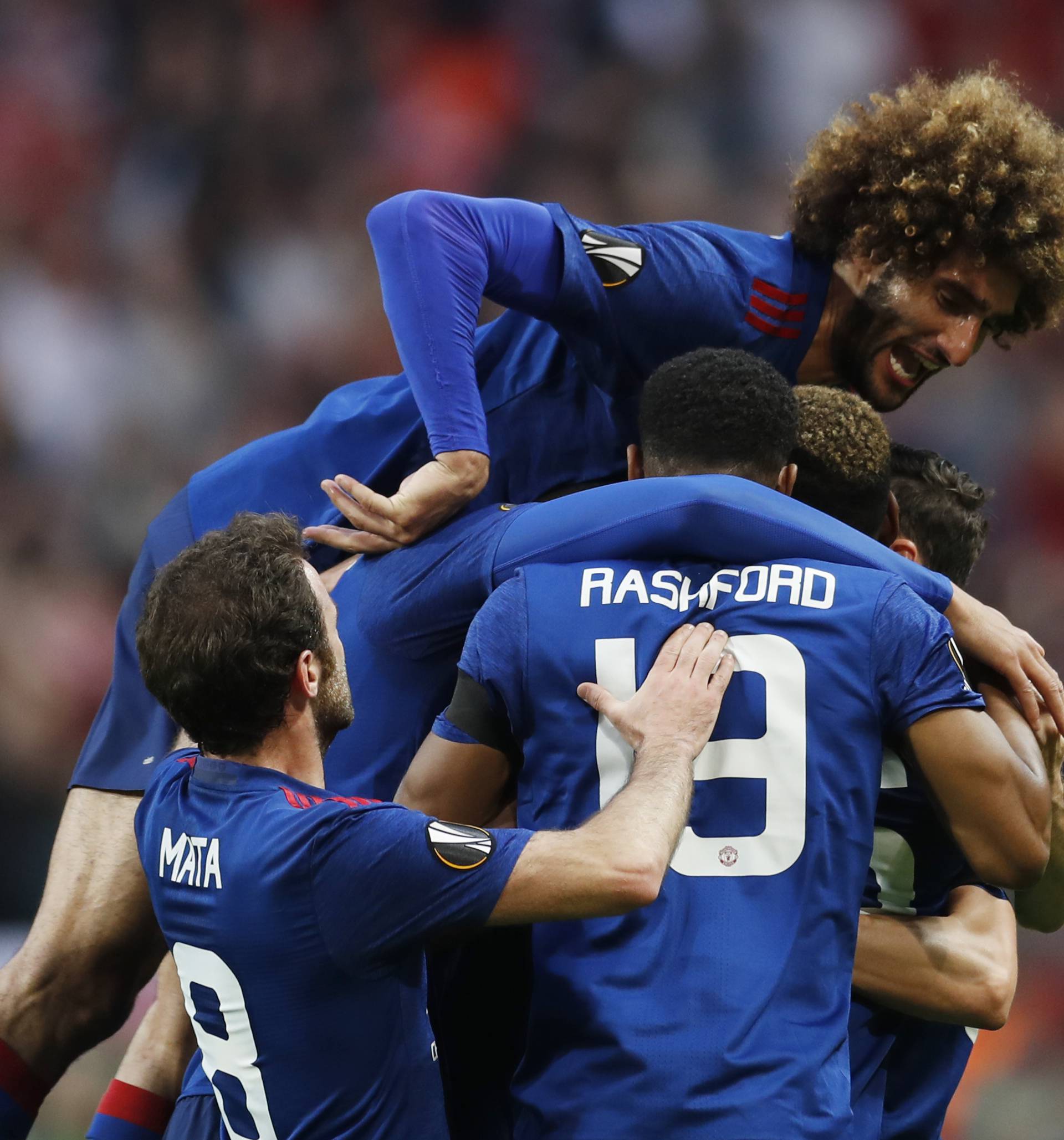 Manchester United's Paul Pogba celebrates scoring their first goal with team mates