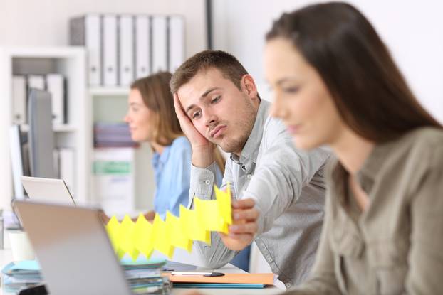 Portrait,Of,A,Lazy,Employee,Boring,Sitting,In,A,Desktop