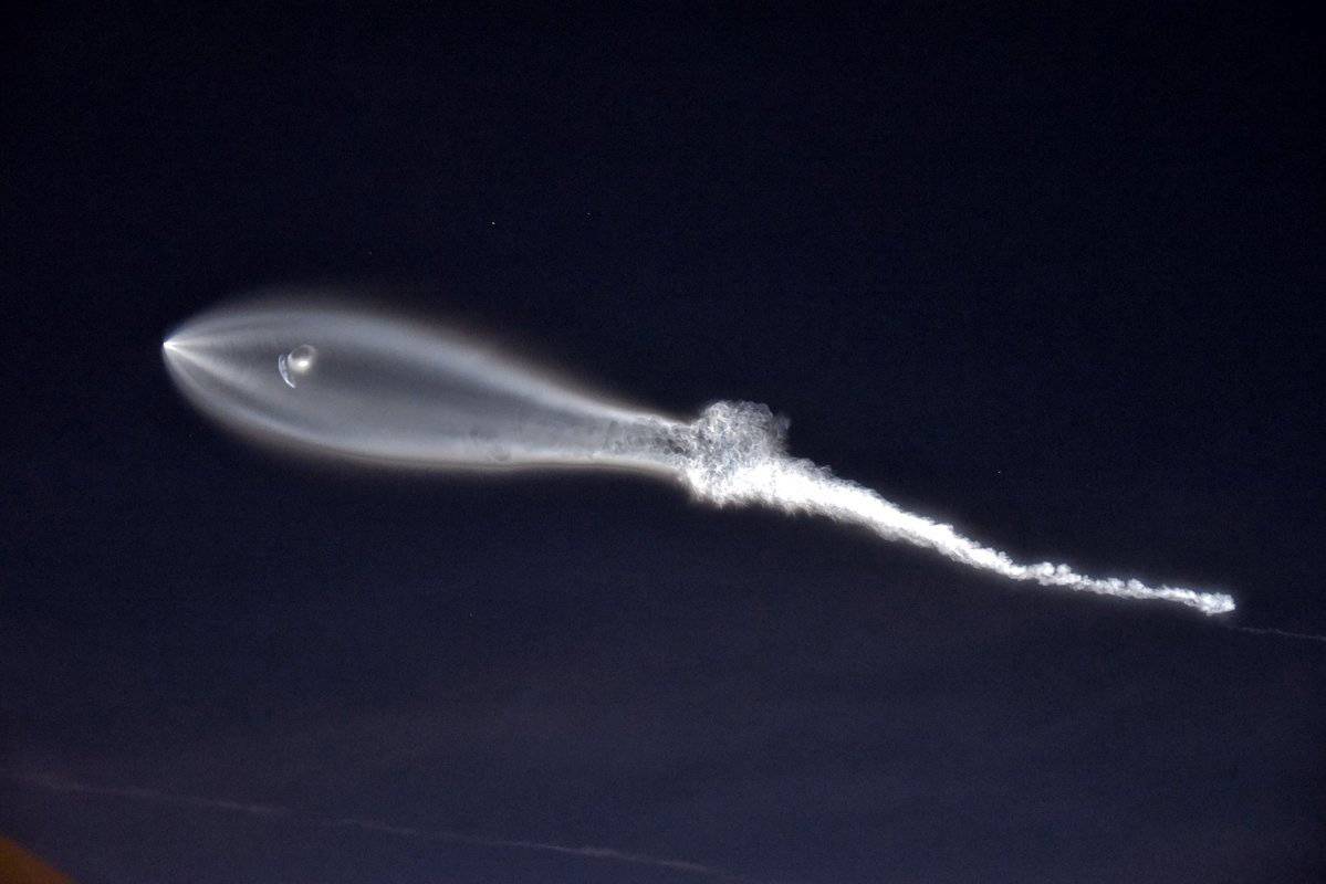 SpaceX's Falcon 9 rocket lifts off in the air, as seen from Santa Monica, California