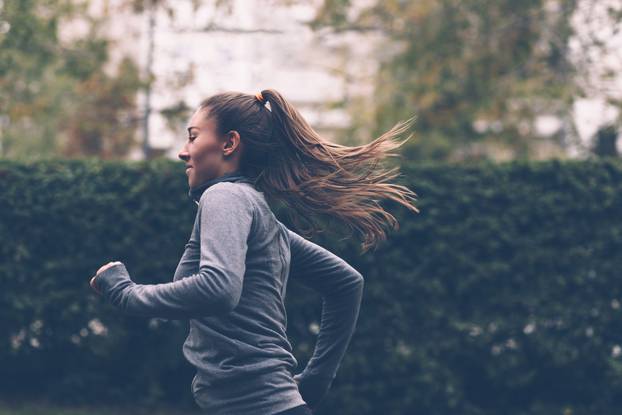Woman,Running.,Female,Runner,Jogging,,Training,For,Marathon.,Fit,Girl