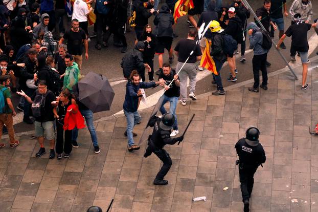 Protesters clash with police during a demonstration at Barcelona