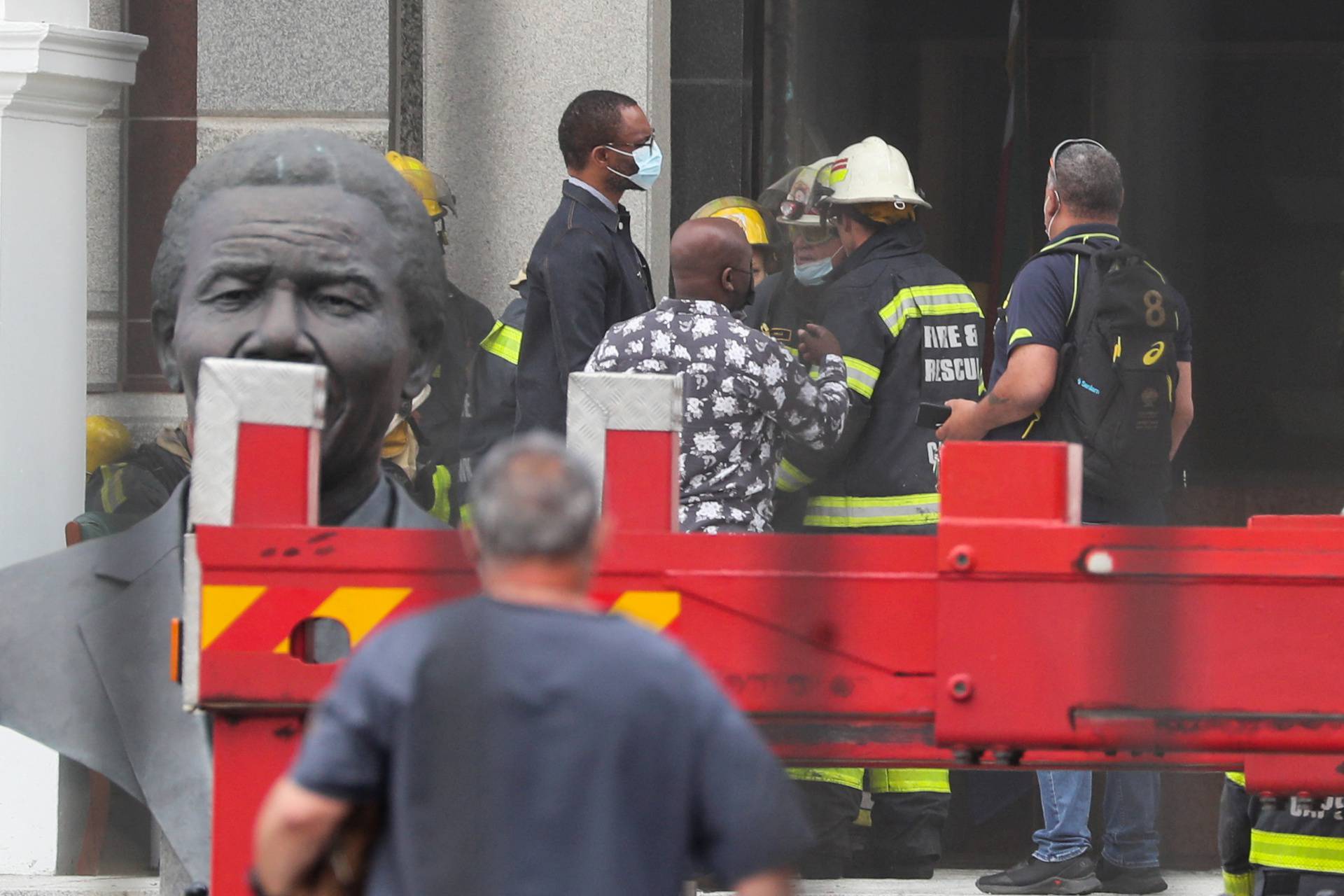 Firefighters work after a fire broke out in the Parliament in Cape Town