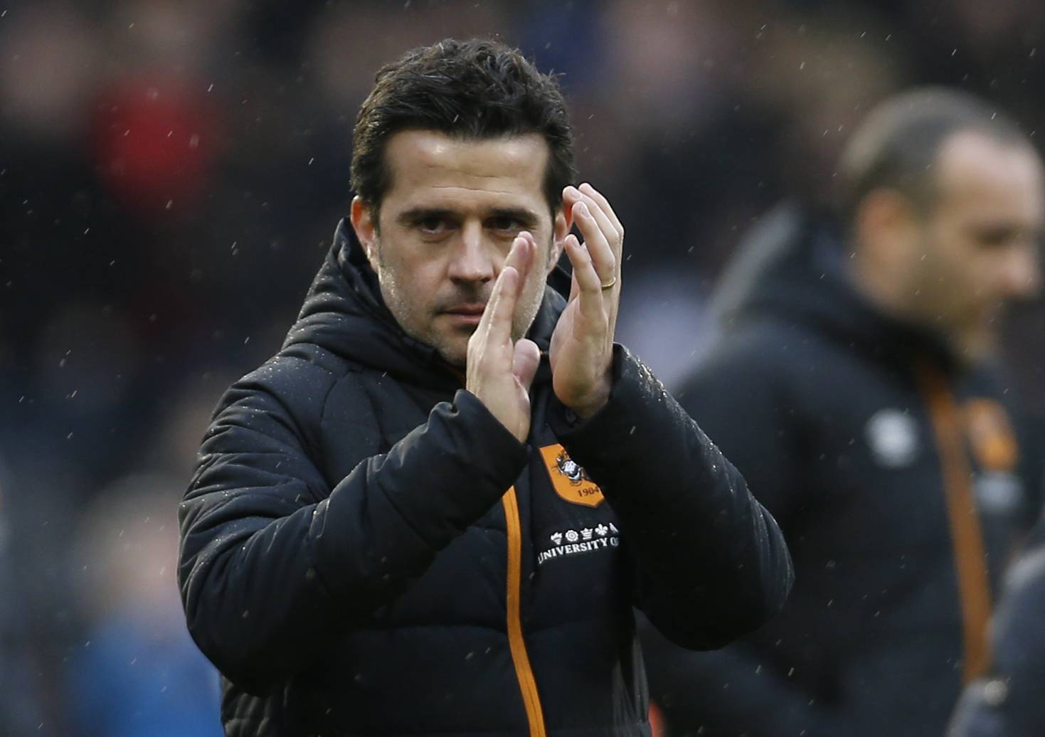 Hull City manager Marco Silva applauds fans after the game