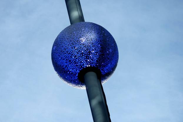 A newly created New Year's eve ball adorned with 5,280 Waterford crystals is raised for the first time above One Times Square ahead of the New Year's Eve ball drop in New York City